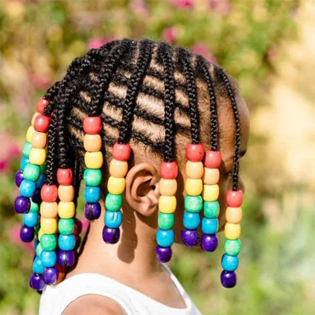little girl braided hairstyle with wooden beads