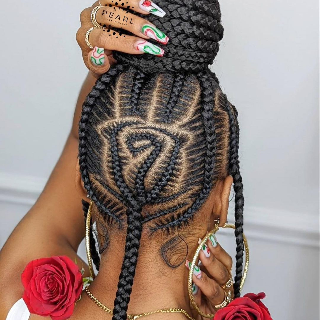 Captivating Cornrow Hairstyles - Top Bun With Rose
