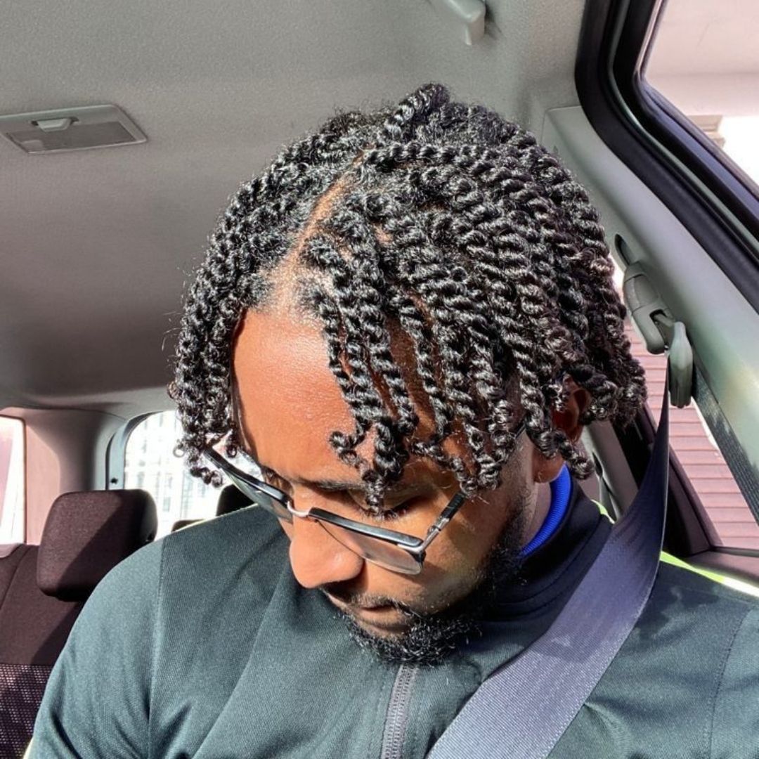 fluffy two strand twists on a black man