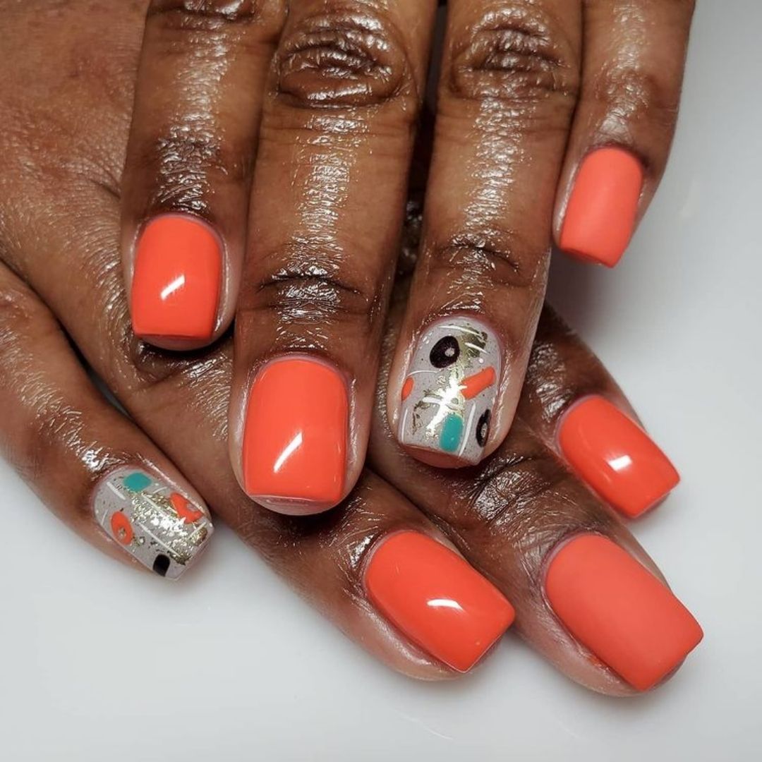 neon orange nails design on black women