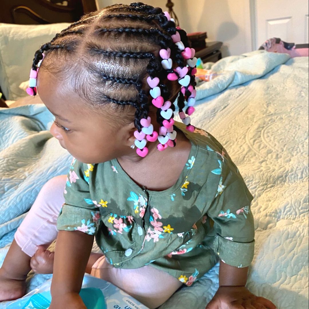 cute braided hairstyle with beads on black baby