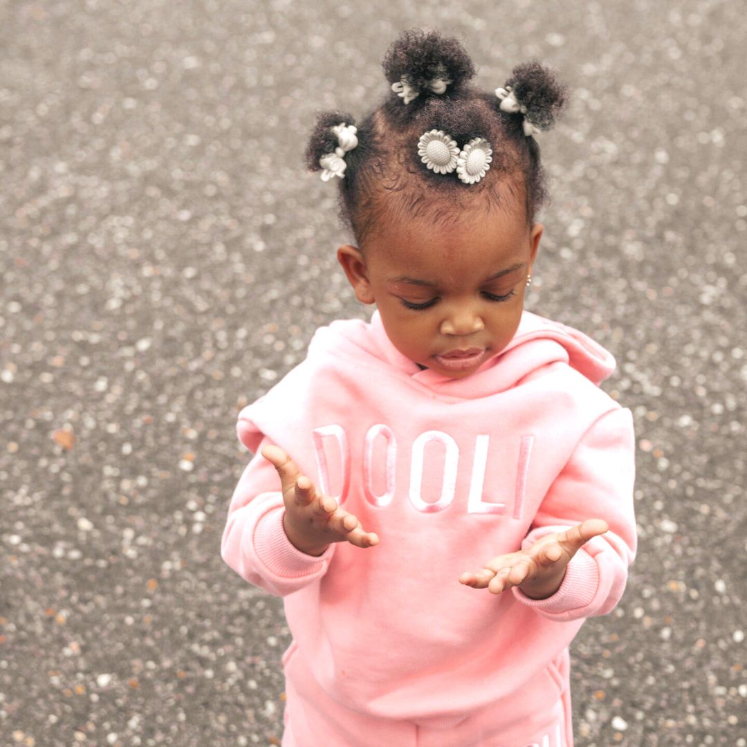 one year old baby girl with cute hairstyle