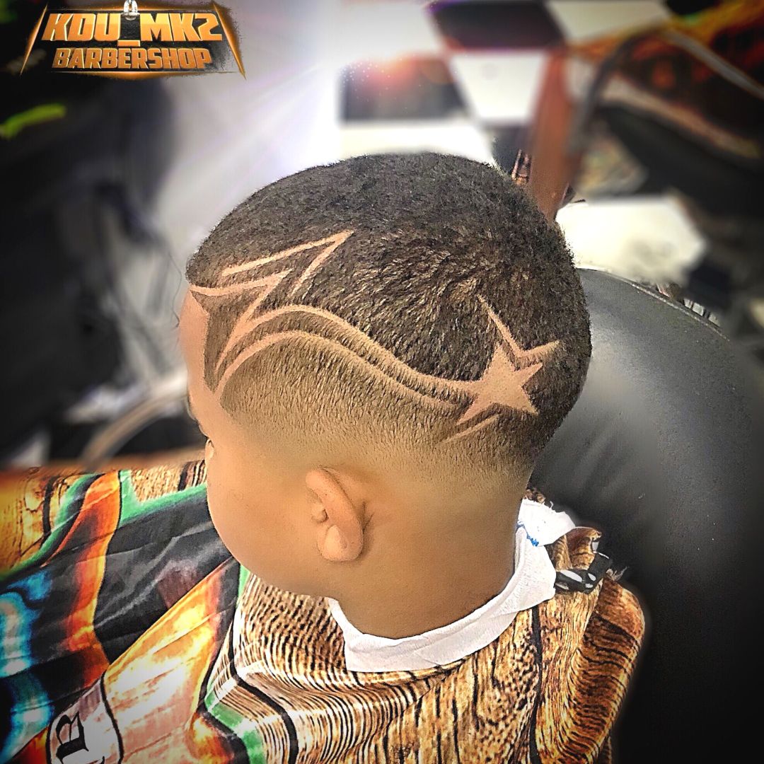 low tribal hair cut on black boy