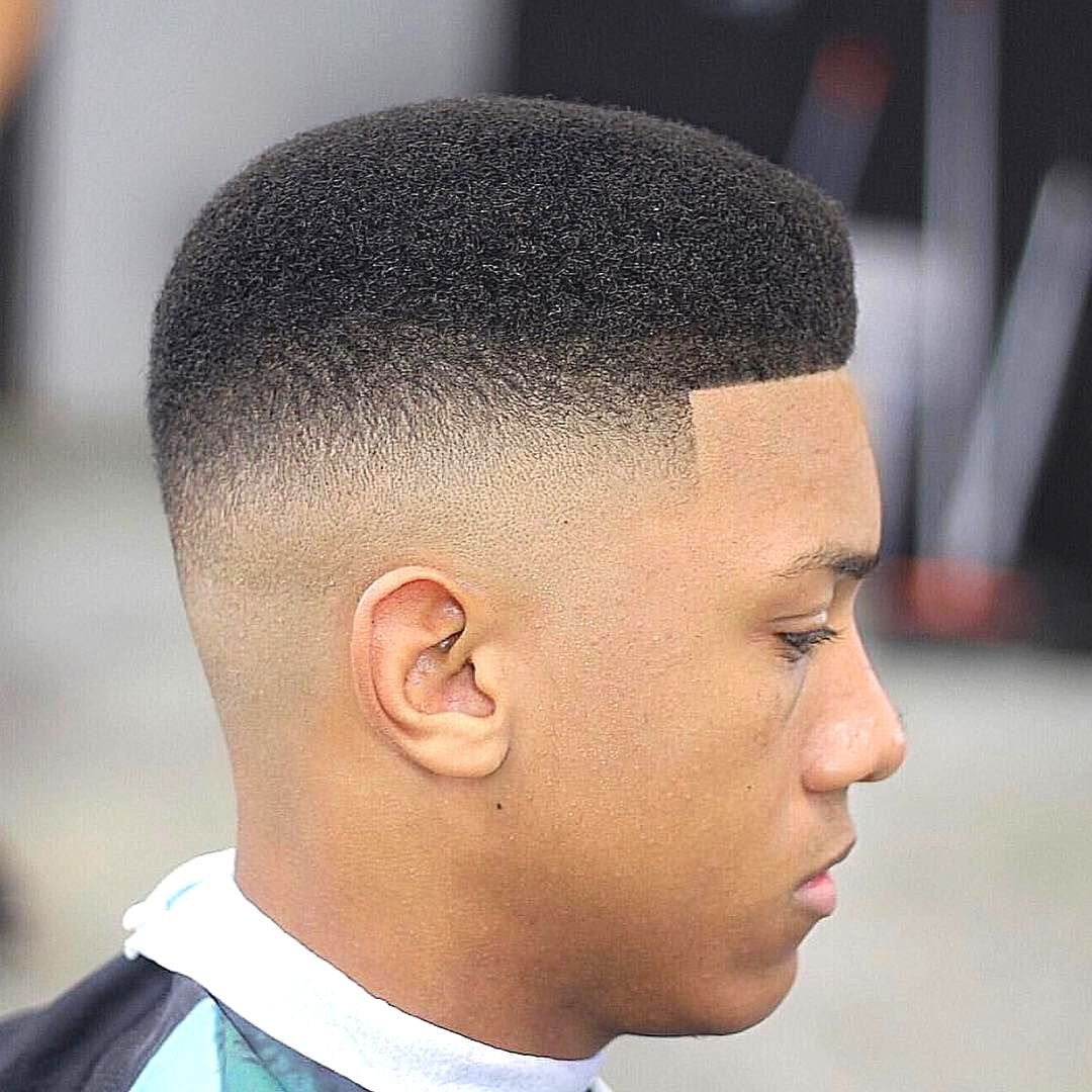 taper fade haircut on black teenage boy