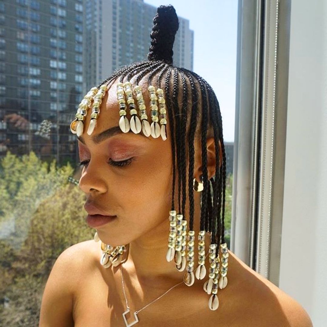 cornrows haistyle with beaded bangs on black women