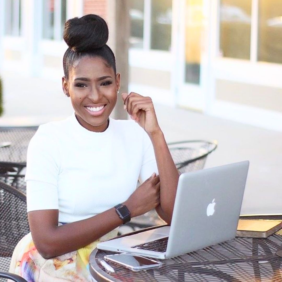 sleek high bun hairstyle for black ladies