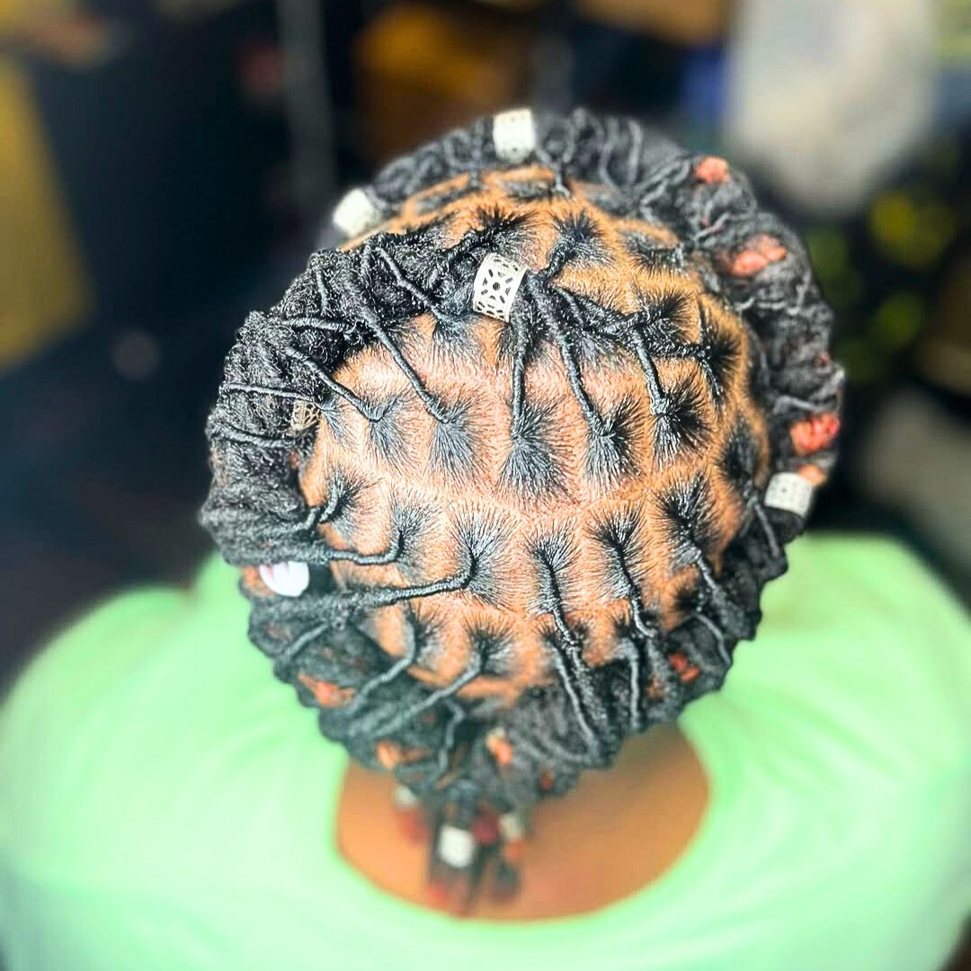 accessorized baby dreads on women