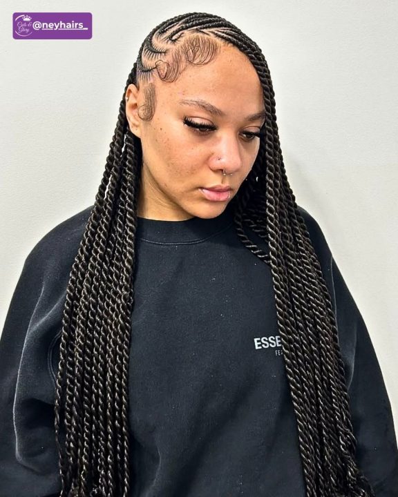 Black Senegalese twists braided in a side-swept lemonade pattern.