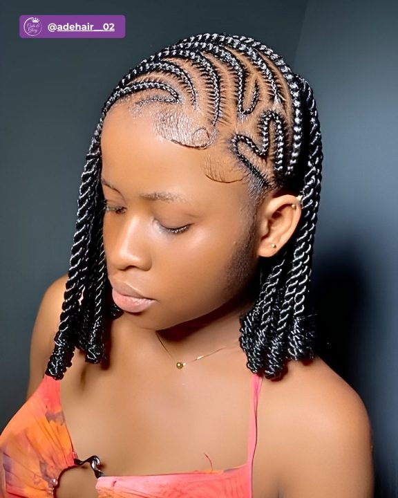 Bob-length Senegalese twists styled in a side-swept lemonade braiding pattern.