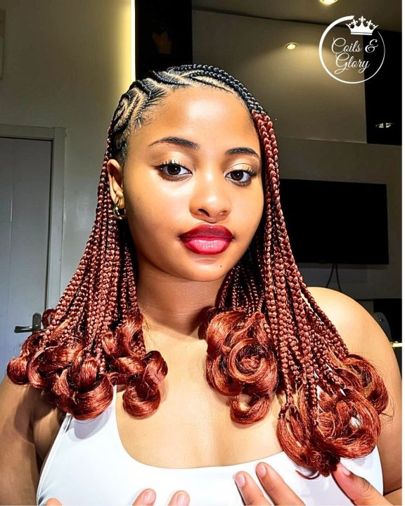Copper-colored lemonade braids finishing with French curls.