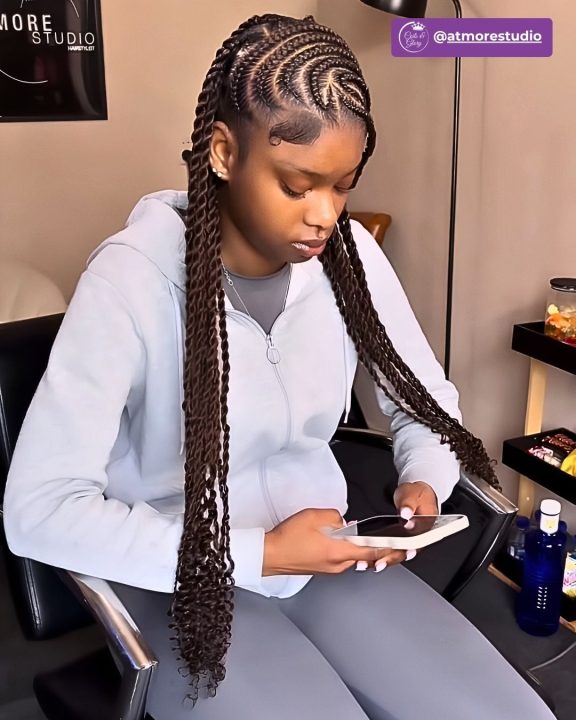 Long dark brown goddess Senegalese twists in a lemonade style with coiled ends.