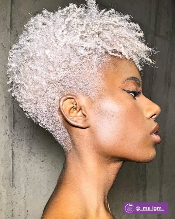 Frost white coiled taper cut hairstyle for women with natural textured hair.