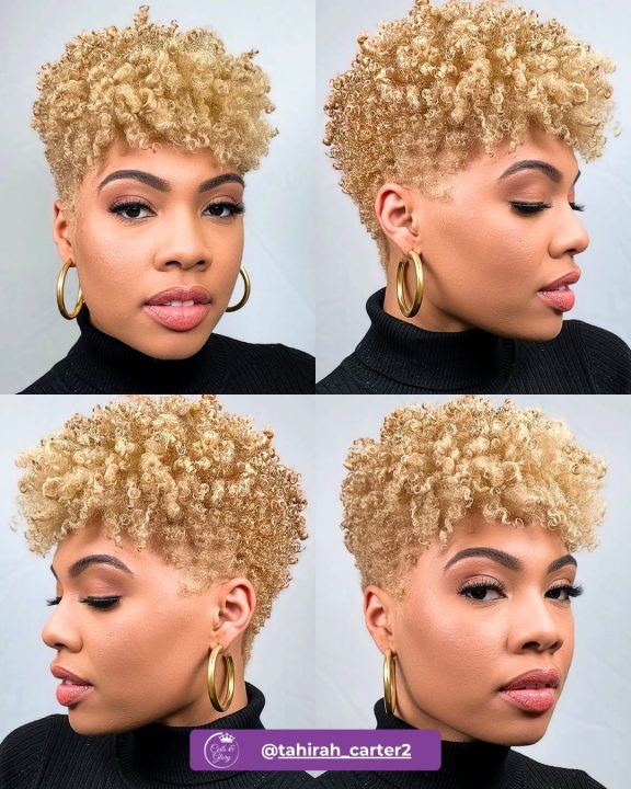 Golden blonde tight-curly taper cut women's haircut with soft temple fade for natural hair.