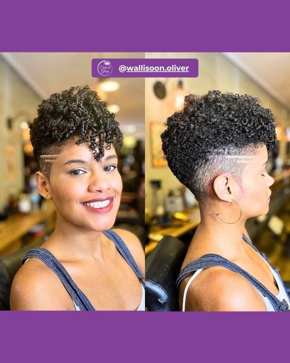 Rich jet black coiled hair tapered neatly along the sides and back, accented by two sharp, parallel razor slashes carved into the clean temple fade.