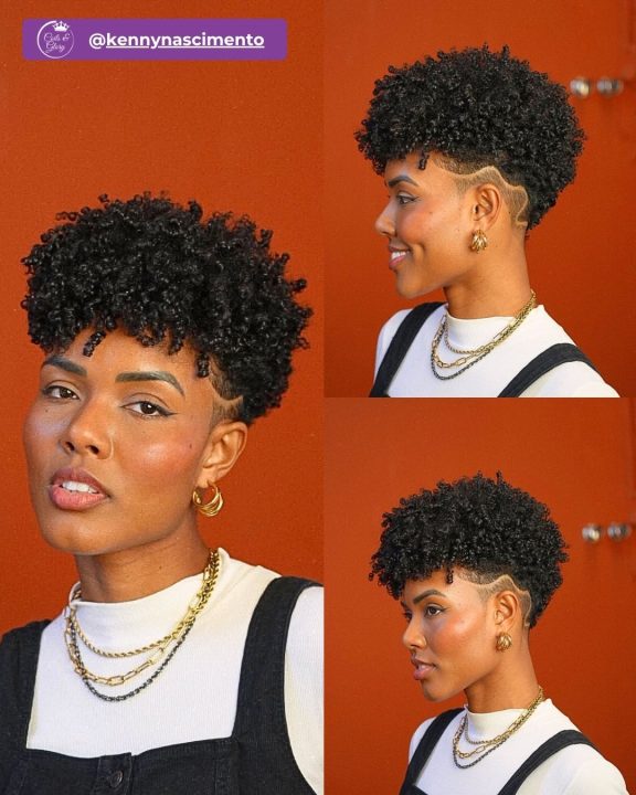 Natural black ringlet frohawk women's haircut featuring wave hair art design on tapered sides.