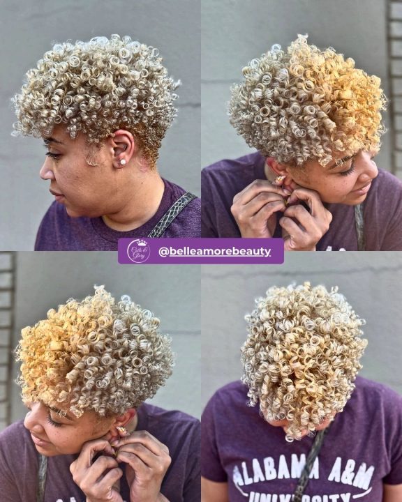 Platinum blonde tight-ringlet pixie cut women's haircut with tapered sides for short natural curly hair.